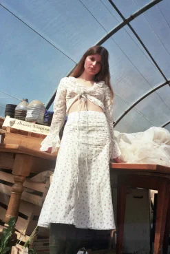 MaisonCléo Jupes>Jupe midi évasée en coton blanc à motif fleurs roses